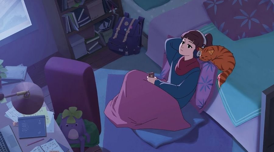 Spotify vs. Apple Music vs. YouTube Music: Hvilken er bedst? 2 En pige sidder på gulvet med sin kat og lytter til musik i sine hovedtelefoner.