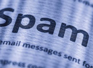 Forstørret "spam"-tekst på et stykke papir