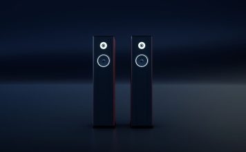 Hvad er Hi-Fi musikstreaming, og er det pengene værd? To sorte, slanke hi-fi-højttalere med hvide ringe omkring enhederne står side om side i et mørkt rum.